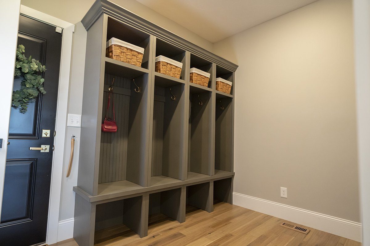 Custom office, laundry, and mudroom cabinetry by Verde Cabinet Studio